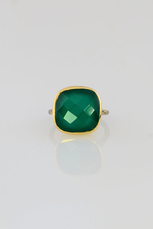 Emerald green stone ring lined with heavy cz -